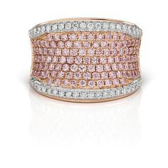 This enchanting ring showcases a pair of brilliant round Argyle pink diamonds, totaling 1.17 carats, nestled within a precious 18KT pink gold setting. These rare and exquisite Argyle pink diamonds are perfectly complemented by 0.45 carats of brilliant round white diamonds, adding a captivating sparkle to the design on Pink Diamond Cut Diamond Ring, Pink Diamond Rings With Diamond Cut, Luxury Pink Diamond Ring With Single Cut Diamonds, Pink Luxury Diamond Ring With Diamond Accents, Luxury Pink Brilliant Cut Diamond Ring, Luxury Pink Diamond Ring With Diamond Accents, Luxury Pink Diamond Ring With Brilliant Cut, Pink Diamond Cut Fine Jewelry Ring, Pink Diamond Ring With Fine Jewelry Style