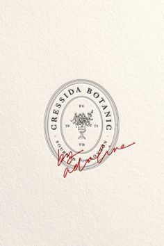 the logo for cressida boanic wines is handwritten in red ink