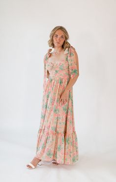 Introducing the Icebreaker Maxi Dress, a captivating blend of elegance and charm. This dress features a bold pink floral print that exudes vibrant appeal, perfect for making a statement. The adjustable bow straps add a touch of whimsy and femininity, while the flattering smocked bodice ensures a perfect fit. The flowing maxi skirt provides stunning movement, making every step a show stopping moment. Bow Straps, Holiday Shoes, Dream Dresses, Pink Floral Print, Dream Dress, Floral Print Dress, Skirt Top, Dress Collection, Pink Floral