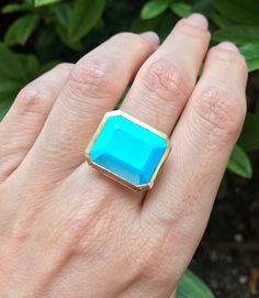 "A genuine large rectangular-shaped faceted Blue Turquoise, Robins Egg Blue Hue aka Sleeping Beauty, set on a minimalist bezel is a great statement/cocktail ring. Made to order in your choice of metal 14k Yellow Gold, Rose Gold or White Gold FINAL SALE Instagram Video ----------------- https://instagram.com/p/BiXzeTqlqIb/ https://instagram.com/p/Biuu4QnFZmJ/ https://instagram.com/p/BjstMbtlEEW/ Face measure 16mmx 18.7mm Shank width 3.5mm Sits off the finger 5.7mm ----> Please note there is an Rectangular Turquoise Gemstone Ring, Turquoise Emerald Cut Jewelry For Anniversary, Turquoise Emerald Cut Gemstone Jewelry, Emerald Cut Turquoise Gemstone Jewelry, Blue 14k Gold Jewelry With Rectangular Stone, Blue Rectangular Faceted Jewelry, 14k Gold Jewelry With Blue Rectangular Stone, Formal 14k Gold Turquoise Blue Ring, Blue Square Cut Gemstone Jewelry