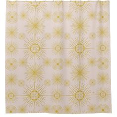 a shower curtain with yellow sunbursts on it