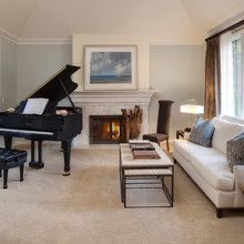 a living room filled with furniture and a piano