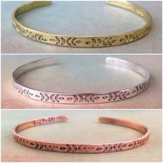 three different types of copper bracelets with engraved designs on the inside and outside of them