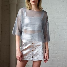 Silver Trace Mini Skirt | Mirimalist | Wolf & Badger Chic Sheer Mini Skirt, Sheer Mini Skirt For Summer, Modern Mini Skirt For Summer, Modern Mini Skirt For Spring, Modern Spring Mini Skirt, Metallic Summer Skirt, Metallic Skirt For Summer, Spring Sheer Mini Skirt, Metallic Mini Skirt For Summer