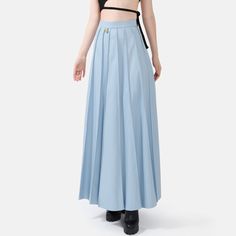 Step into effortless elegance with the Solace Vegan Leather Pleated Maxi Skirt in powder blue. With a hidden zip closure and stylish golden embellishments, this skirt combines sophistication with a touch of luxury. The lightweight fabric drapes beautifully, offering a relaxed yet structured fit with just the right amount of stretch for comfort and durability. The vertical hand-pleating creates a flattering silhouette by elongating the lower body. Perfect for stylish occasions where comfort is ke Hand Pleating, Maxi Skirt Blue, Pleated Maxi Skirt, Pleated Maxi, Effortless Elegance, Draped Fabric, Pleated Midi Skirt, Lower Body, Independent Designers Fashion