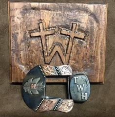 Handcrafted custom belt buckle. Each piece is carefully crafted by Duayne in the great state of Texas.  Overlays are available in Silver, Copper, or a combination. "Each piece tells a story and takes on a life of its own. It starts with the raw material and then turns into a handcrafted work of art special to each customer." Duayne Williams There are several styles to choose from. Please see the photo of the styles available and indicate which letter style you would like.  Most buckles are 1 1/2" wide to fit the standard belt. However, we are able to build custom sizes. Please send a message or email. **Completion times will vary (2-3 weeks is average in non holiday season). If you have a deadline, please contact us before you order. Custom and personalized orders Due to the nature of cust Artisan Engraved Belt Buckles As Gift, Artisan Engraved Belt Buckles For Gifts, Handmade Western Belt Buckles As Gift, Handmade Western Belt Buckles For Gift, Custom Belt Buckles, Cattle Brands, Western Belt Buckles, State Of Texas, Custom Belt