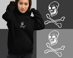 Comfortable and casual happy skull graphic hoodie! This laughing skull / jolly roger design will brighten your mood and let people know you are totally approachable! Perfect design for anyone who might consider themselves goth, emo, or scene. Get one today or gift to your favorite person. * 50% pre-shrunk cotton, 50% polyester * Fabric weight: 8.0 oz/yd² (271.25 g/m²) * Air-jet spun yarn with a soft feel and reduced pilling * Double-lined hood with matching drawcord * Quarter-turned body to avoid crease down the middle * 1 × 1 athletic rib-knit cuffs and waistband with spandex * Front pouch pocket * Double-needle stitched collar, shoulders, armholes, cuffs, and hem * Blank product sourced from Honduras, Mexico, or Nicaragua This product is made especially for you as soon as you place an or Black Skull Hoodie For Halloween, Black Alternative Style Sweatshirt With Skull Print, Punk Skull Hoodie For Halloween, Edgy Skull Print Hoodie For Halloween, Punk Halloween Hoodie With Skull Design, Punk Style Cotton Hoodie With Skull Print, Punk Halloween Hoodie With Skull Print, Halloween Punk Hoodie With Skull Print, Halloween Skull Hoodie For Streetwear