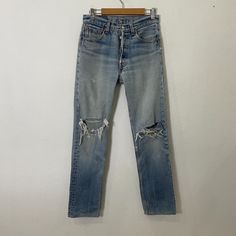 [DESCRIPTION] Please read the description first before buy my items‼️‼️‼️ Vintage 90s Levis Distressed Denim Jeans Size on tag: 27 All in good condition [MATERIAL] Cutton [MEASUREMENT] Measurement ( WHEN LAID FLAT ): Waist: 28 inch (recommended) Insean: 29 inch Length: 37 inch Front Rise: 10 inch Thigh: 19 inch Opening Leg: 14 inch [CONDITION] - All in good condition  - Kindly please refer photo [PAYMENT & NOTICE] - No return/refund - All items will be post over shipping company counter within 1 90s High Waist Distressed Jeans, 90s Distressed Mid-rise Jeans, 90s Mid-rise Distressed Jeans, 90s Style Distressed Denim Blue Jeans, 90s Distressed Denim Blue Jeans, 90s High Waist Ripped Jeans, 90s Style Ripped Blue Jeans, 90s Ripped High Rise Jeans, 90s High Rise Ripped Jeans