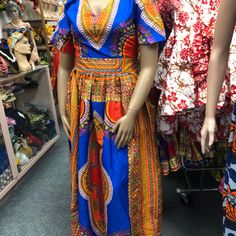 African Clothing For Women Danshiki Ankara Print Handmade Long Dress. Blue Background Mannequin Is Wearing. Size 10 Contact Me For Questions About This Dress V-neck Batik Print Festival Dress, Traditional Multicolor V-neck Maxi Dress, Traditional Multicolor Sleeveless Maxi Dress, Bohemian Blue Dress With Colorful Pattern, Blue Bohemian Dress With Colorful Pattern, Blue Floor-length Maxi Dress For Festival, Spring Bohemian Royal Blue Dress, Traditional Batik Print Maxi Dress For Spring, Blue Printed Maxi Dress For Festival