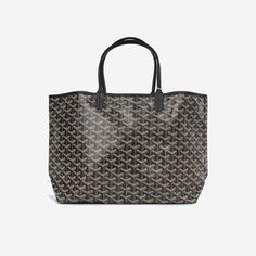 The Goyard tote is a highly sought after bag which is loved by high profile celebrities. Due to its unique and eye catching design, the bag is instantly recognisable and is the perfect daytime tote for shopping. This Saint Louis PM is the bag to own and although it is lightweight, it's highly durable and can hold a lot of weight. For fashion forward women who want a sophisticated daytime tote, this is the bag to buy. SPL Exterior Black goyardine canvas Chevroches calfskin trim Palladium hardware Black leather top handles Open top Brand new Interior Linen and cotton mix interior Single compartment Removable pochette Brand new Sold with dustbag and pochette SPL Height 28cm Width 34cm Depth 15cm Goyard Tote, Black Leather Top, Timeless Handbag, Saint Louis, Bags Designer Fashion, Exclusive Bag, Open Top, Black Canvas, Fendi Bags