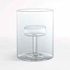 an empty wine glass sitting on top of a table