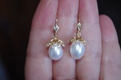 Japan 14k golden white tear drop cultured pearl w fancy cz leverback earrings being offered is a fabulous 14k 27mm large golden / white japan cultured pearls perfect tear drop white / golden pearl earrings these earrings jackets are new old stock pearls they are from japan , quality lustorous , well matched japanese pearls are famous for being top rated quality they are new old stocks plesae see photos. 17 x 10 mm including connectors pearl teardops noticeable size with gorgeous gf fancy cz conn Earrings Jackets, Pearl Earring Jacket, Japanese Pearls, Golden Pearl, Earring Jackets, Japan Culture, Leverback Earrings, Emerald Earrings, Earrings Photo