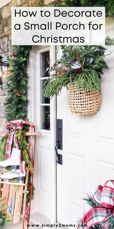 a small porch decorated for christmas with wreaths and greenery on the front door