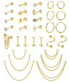 various types of piercings and chains on a white background