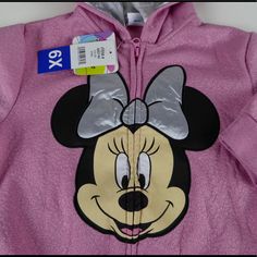 Minnie Mouse Hoodie Full Zip Hoodie Attached Hood W “Ears” Sparkly Thread Woven Throughout Ribbed Cuffs/Hem Large Minnie Graphics On Front Silver Material Hood Lining Front Hand Pockets Brand New With Tags Pricing Is Fair And Quite Firm . Please Let Us Know If You Have Any Questions. Cute Winter Mickey Mouse Sweatshirt, Cute Mickey Mouse Winter Sweatshirt, Disney Winter Hooded Tops, Disney Hooded Winter Tops, Mickey Mouse Hooded Tops For Winter, Cute Mickey Mouse Hoodie, Winter Mickey Mouse Hooded Top, Cute Long Sleeve Mickey Mouse Hoodie, Cute Mickey Mouse Hoodie For Winter