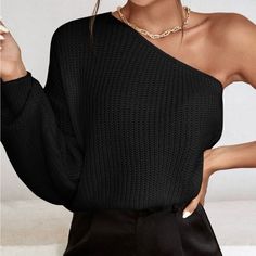 Dare To Show A Little Skin In This New Black Ribbed One-Shoulder Sweater. This Cute Little Number Is Shaped By Ribbed Stretch Knit And Has A Sexy One-Shoulder Neckline That Leads Into A Long Loose Sleeve. Pair This Top With High-Waisted Denim And A Trendy Ankle Bootie For A Smoldering Look. One Sleeve Sweater, One Sleeve Top Outfit, One Shoulder Sweater, Couple Shoots, Asymmetrical Sweater, Simple Summer, Pullover Outfit, Women Sweaters, Ankle Bootie