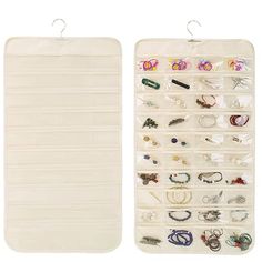 two white hanging jewelry cases with earring holders on top of each one and the bottom is filled with different types of earrings