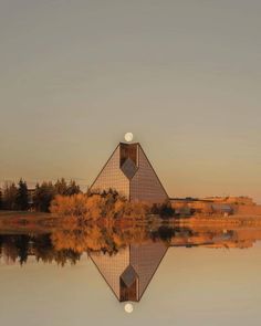 the reflection of trees in the water is shown