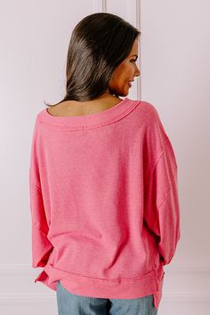 - Add this casual piece to your trendy wardrobe this season! - Unlined waffle knit material with unfinished seam detail - A v-cut neckline - Long, loose drop sleeves - A relaxed silhouette that ends in an uneven hemline Pink Textured Knit Relaxed Fit Top, Oversized Textured Knit Pink Top, Pink V-neck Sweater For Loungewear, Pink Textured Knit Tops For Layering, Pink Knit V-neck Top, Pink Knit Tops For Loungewear, Oversized Pink Top With Ribbed Neckline, Oversized Pink V-neck Top, Pink Soft Knit Tops For Loungewear