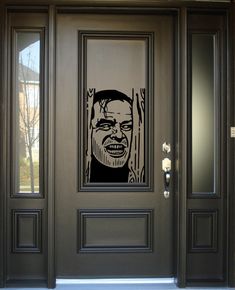 a door with a drawing of a man's face on the front and side