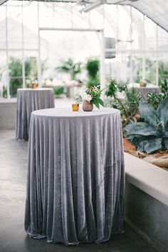 the table is covered with a gray cloth