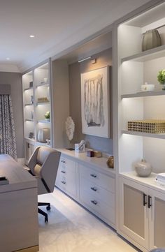 an office with white furniture and shelves filled with vases