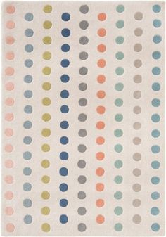 a white rug with multicolored dots on it