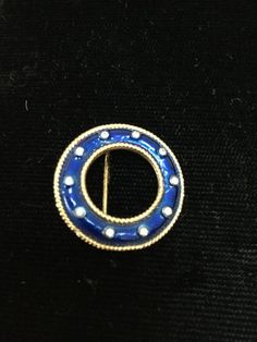 Exquisite Trifari brooch done on brilliant gold plated metal.  Entire circle enameled in a gorgeous royal blue.  Gold roping inside and out and clear chatons dotted in center of enameling.  Measuring 3/4” diameter.  STUNNING! Trifari Brooch, Blue Necklace, Drop Necklace, Blue Gold, Brooches, Royal Blue, Gold Plate, Silver Rings, Etsy Gift Card