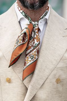 This floral pattern with hand-rolled hems will give your look an elegant twist. This scarf is a testament to timeless craftsmanship, a blend of care, and passion. The classic neckerchief size: Approx. 27" x 27". A comfortably large size that fits most men, unlike smaller bandanas. 100% silk twill: A soft, silky fabric traditionally used in men's tailoring for its look and its drape. Characterized by a diagonal weave which makes it very durable. Hand rolled hems: For the ultimate in luxury and so Elegant Mens Fashion, Orchestra Photoshoot, Neckerchief Outfit Men, Neck Scarf Men, Mens Scarf Fashion, Man Scarf, Mens Cravats, Scarves Men, Badass Beard