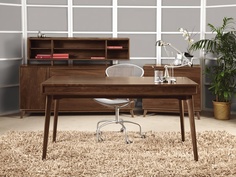 an office with a desk, chair and bookcase in the middle of carpeted flooring