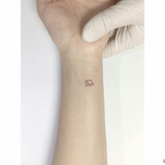 a small elephant tattoo on the wrist