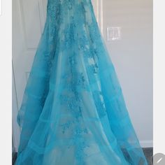 Luxurious Charming Tulle V Neckline Evening Dress With Rine Stones ,And Lace Applique Nwt Never Worn . Size 10 ..Waist 29.75. Hips 39.75. Shoulders Width 15.. 75..Hollow To Floor 59.75 Fitted Blue Organza Evening Dress, Blue Dress With Tulle Skirt And Fitted Bodice, Blue Organza Gala Dress, Blue Organza Dress For Gala, Blue Organza Gown For Gala, Blue Organza Gown For Galas, Blue Gown With Tulle Skirt And Fitted Bodice, Blue Lace Dress With Fitted Bodice, Blue Lace Dresses With Fitted Bodice