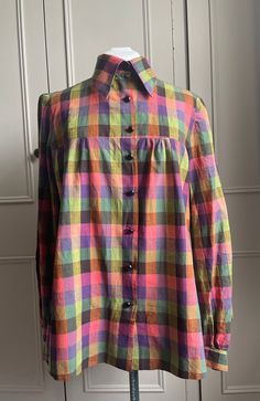 Beautiful vintage 1970s checked shirt that has been handmade therefore doesn't have a label. Button front opening and long sleeves with a large 70s collar. Fabric is 100% cotton. Measurements Chest 96cm length 70cm Retro Long Sleeve Plaid Shirt, Plaid Cotton Collared Blouse, Retro Plaid Collared Tops, Vintage Plaid Long Sleeve Tops, Retro Long Sleeve Shirt With Placket, Vintage Plaid Cotton Blouse, Plaid Cotton Blouse With Buttons, Vintage Plaid Button-up Blouse, Vintage Plaid Collared Shirt