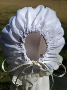 Please read shop announcement! Please read my shop announcement! This beautiful french Machine sewn bonnet is made using white Imperial poly/cotton batiste fabric, Swiss Embroidered Lace and French Valenciennes lace. Delicate ivory lace decorates the bonnet. The back of the bonnet is adjustable with double-face satin ribbon. Satin ribbon closes the neck under the chin. The bonnet can also be made using other fabric colors. See picture for available colors. You can select another color during che White Fitted Bonnet For Baptism, Fitted White Bonnet For Baptism, Adjustable Cream Bonnet As A Gift, Adjustable Cream Bonnet As Gift, Adjustable Cream Bonnet For Baptism, White Adjustable Hat For Baptism, White Bonnet Gift, One Size Fits Most, White Bonnet, One Size Fits Most, Gift, White Bonnet Gift (one Size Fits Most)