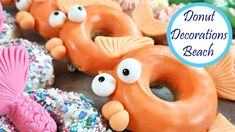 donuts decorated like fish and sea creatures with sprinkles