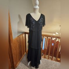 This Dress Is Perfect For A Wedding Or For A Special Event. This Dress Is A Slip On Dress With Sequin Embellishments On Top Very Pretty And Simple. Black Formal Gown With Short Sleeves, Formal Black Gown With Short Sleeves, Formal Black Short Sleeve Gown, Black Short Sleeve Gown For Party, Black Short Sleeve Party Gown, Black Evening Mother Of The Bride Dress For Wedding, Black Mother Of The Bride Dress For Evening Wedding, Black Evening Dress For Holiday Wedding, Black Evening Dress For Wedding Holiday