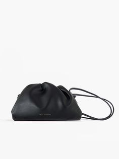 A classic day-to-night favorite from FREYA ESTEPHAN. Pouch handbag with shoulder strap * 100% genuine leather  * Mini: 22 cm wide x 5.5 cm deep x 13 cm high * Medium: 31 cm wide x 7 cm deep x 18 cm high  * Magnetic frame closure. Gold finish * Strap height: 53 cm NEW, with tags and box. Color: Black Black Leather Pouch With Adjustable Strap, Black Leather Top Handle Pouch, Black Leather Pouch With Detachable Strap, Black Soft Leather Crossbody Pouch, Black Leather Evening Pouch, Black Soft Leather Clutch Pouch, Elegant Soft Leather Black Pouch, Elegant Black Soft Leather Pouch, Magnetic Frame