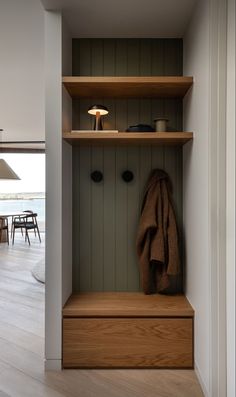 a coat rack in the corner of a room