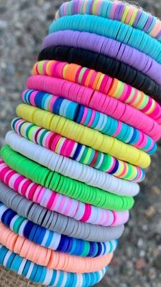 colorful bracelets are stacked on top of each other