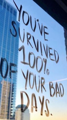 a window with writing on it that says you've survived 100 % of your bad days