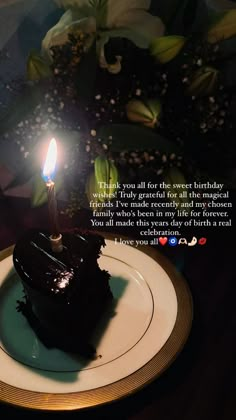 a piece of chocolate cake on a plate with a lit candle in the middle that says, thank you all for the sweet birthday