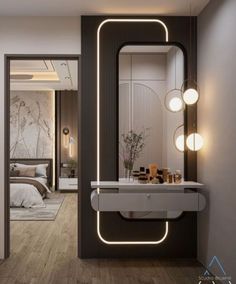 a bathroom sink sitting under a large mirror next to a doorway with lights on it