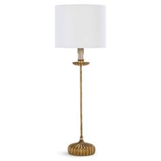 a gold lamp with a white shade on it