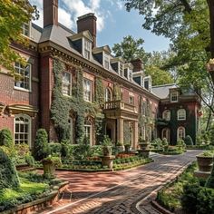 a large red brick house with many windows