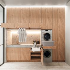 a washer and dryer in a room with wood paneling on the walls