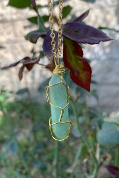 "Beautiful gold wire wrapped green Aventurine crystal point pendant on gold plated chain with lobster claw closure. The pendant is approximately 1.2\" long and 0.4\" wide. Please note that all crystals are unique and therefore color, shape and size may vary slightly. Please choose a necklace length from the drop-down menu. In case you would like a length other than the listed options, leave us a note at checkout. Item will be shipped 1 - 2 business days after purchase. \"Green Aventurine is know Spiritual Gold Aventurine Necklace, Spiritual Aventurine Gold Necklace, Gold Aventurine Necklaces For Healing, Aventurine Wire Wrapped Necklace For Healing, Green Wire Wrapped Crystal Necklace Gift, Green Wire Wrapped Crystal Necklace For Healing, Wire Wrapped Crystal Pendant, Green Aventurine Necklace, Cross Charm Necklace