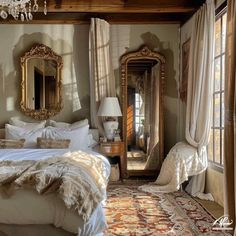 a bedroom with a bed, mirror and chandelier on the wall in it