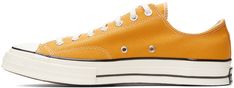 Low-top canvas sneakers in yellow. · Round rubber cap toe · Lace-up closure in white · Eyelet vents at inner side · Rubber sole featuring rubberized logo patch at heel Supplier color: Sunflower/Black/Egret Yellow Casual Sneakers With Rubber Toe Cap, Casual Yellow Sneakers With Rubber Toe Cap, Yellow Canvas High-top Sneakers With Vulcanized Sole, Sporty Yellow Sneakers, Yellow High-top Sneakers With Rubber Toe Cap, Yellow Low-top Sneakers With Rubber Toe Cap, Yellow Canvas Lace-up High-top Sneakers, Yellow Lace-up Canvas High-top Sneakers, Yellow Converse Canvas Sneakers