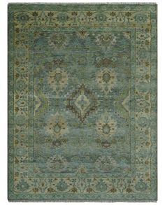 an area rug with green and beige colors