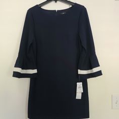 Beautiful Dress, Never Worn, Still Has Original Tags. Excellent Condition. Pit To Pit Measures 20 Inches As Shown In Last Picture Spring Navy Long Sleeve Mini Dress, Blue Shift Dress For Party, Blue Shift Dresses For Party, Elegant Navy Spring Dresses, Blue Long Sleeve Lined Mini Dress, Chic Navy Spring Dress, Chic Navy Dress For Spring, Navy Knee-length Mini Dress For Spring, Chic Blue Shift Mini Dress